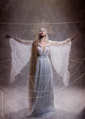 Goddess of fate moira with scissors is preparing to cut the thread of life. Ancient mythology