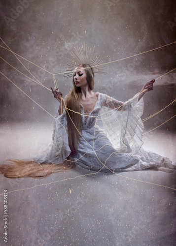 Goddess of fate moira with scissors is preparing to cut the thread of life. Ancient mythology