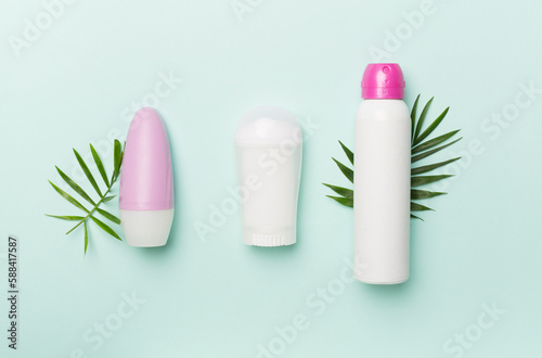 Natural deodorants on color background, top view