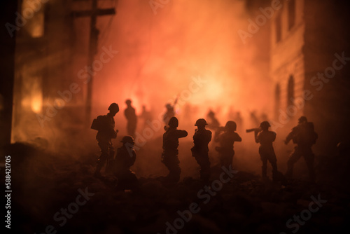 War Concept. Battle scene on war fog sky background, Fighting silhouettes Below Cloudy Skyline at night. City destroyed by war