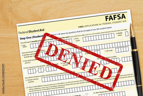 US federal Student Loan application form denied on a desk photo