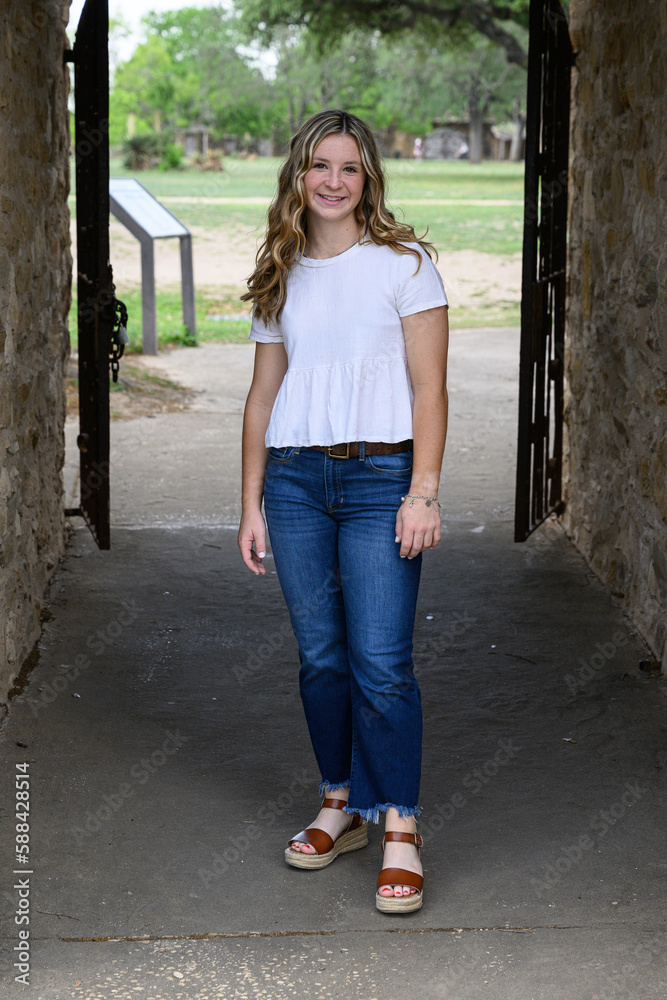 Young pretty teenage girl posing in a historic setting for her high school graduation photos Young pretty teenage girl posing in a historic setting for her high school graduation photos