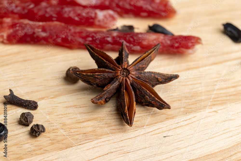 Dried veal sausage during slicing