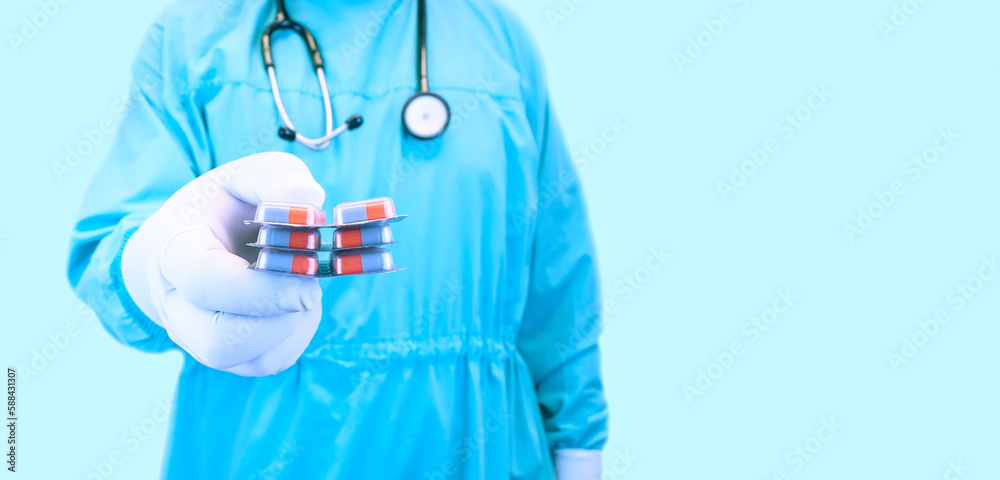 Diet. Nutrition. Healthy eating, lifestyle. Vitamin D, E, A in capsule. Prescription medical concept. Pharmacist. Variety of pills. Doctor with tablets isolated on light blue background Diet. Nutrition. Healthy eating, lifestyle. Vitamin D, E, A in capsule. Prescription medical concept. Pharmacist. Variety of pills. Doctor with tablets isolated on light blue background
