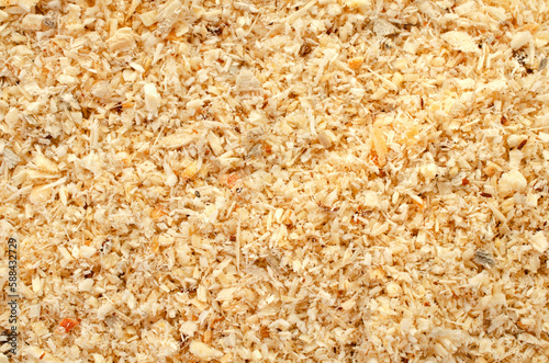Wood sawdust, background, texture, top view. Pile of sawdust, background. Heap of wood shavings, background, texture, top view.
