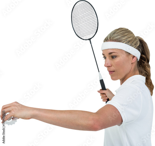 Female athlete holding a badminton racquet ready to serve 