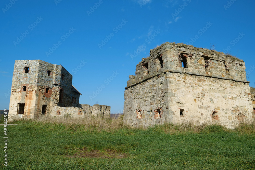 Ancient stone towers in Pniv Castle - medieval historical object, Ukraine