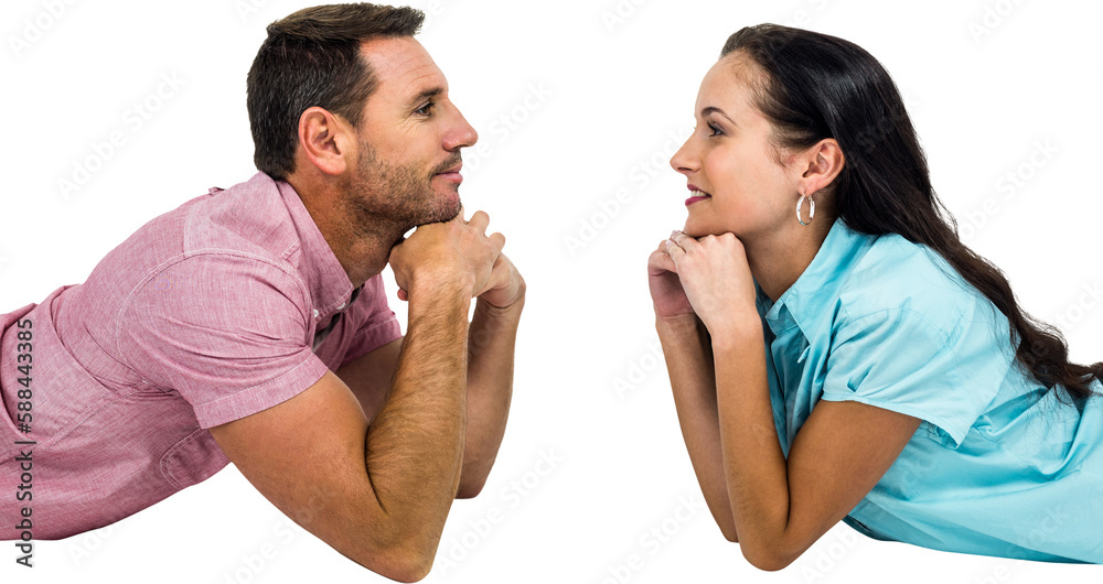 Happy couple laying on floor looking at each other Happy couple laying on floor looking at each other