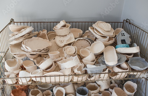 There are a lot of different clay dishes that are ready for baki