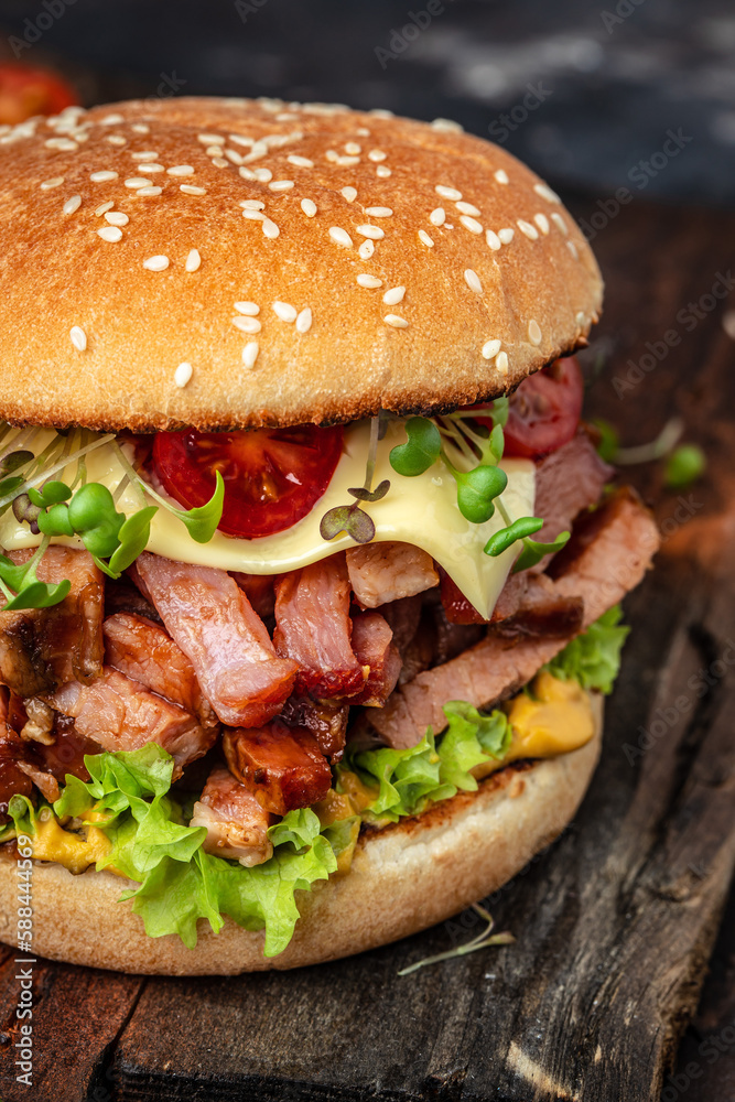 delicious homemade burgers of beef, cheese and vegetables on a wooden board, Hamburger. Fast food concept delicious homemade burgers of beef, cheese and vegetables on a wooden board, Hamburger. Fast food concept