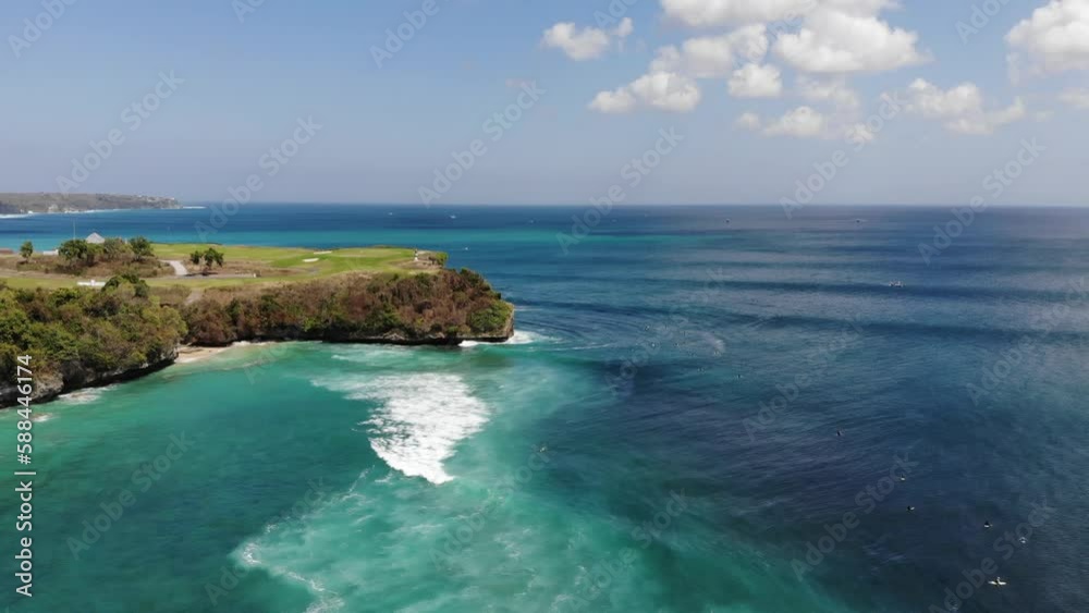 aerial drone view of surfers at beach in Uluwatu Bali aerial drone view of surfers at beach in Uluwatu Bali