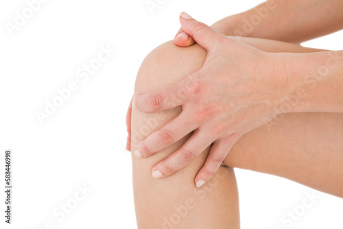 Natural woman touching her painful knee 