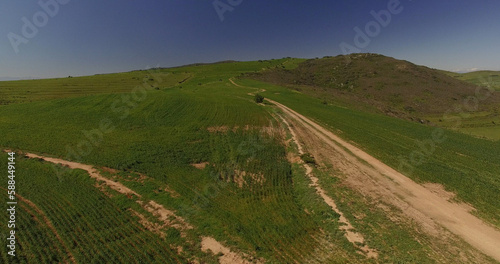 High angle view of dirt road on landscape
