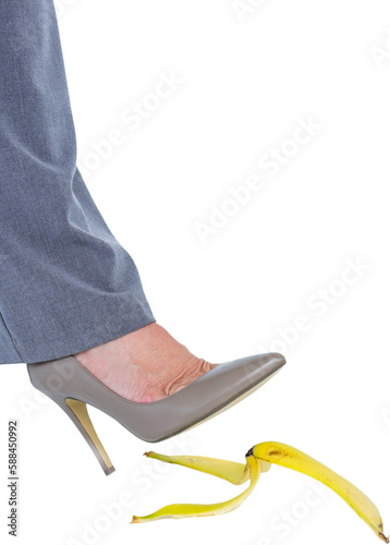 Businesswoman about to step on banana peel