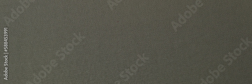 Dark gray fabric background closeup. Abstract gray background