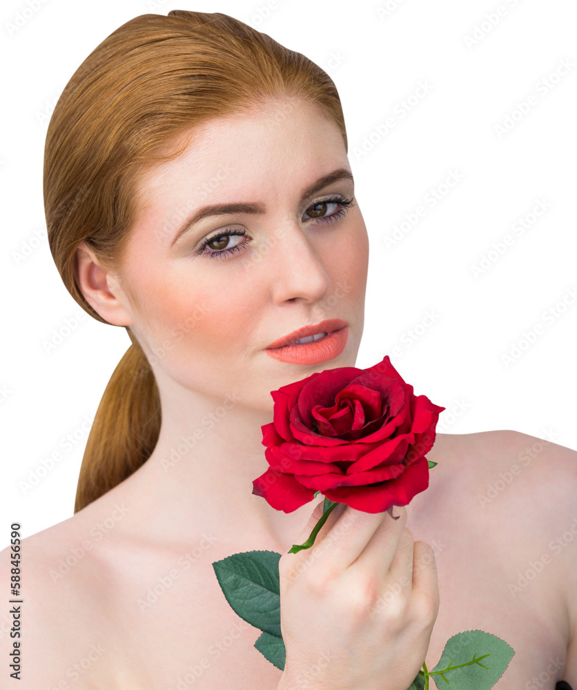 Obraz premium Beautiful redhead posing with red rose