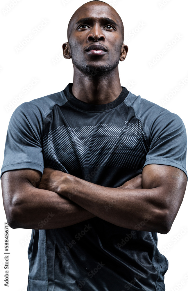 Thoughtful athlete standing with arms crossed