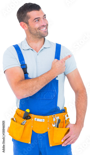 Repairman in overalls pointing on white background