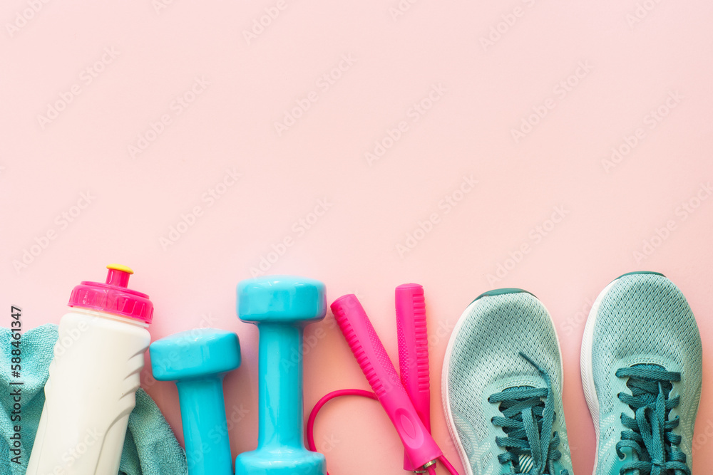 Fitness background, healthy lifestyle concept. Dumbbells, sneakers, towel and water bottle top view. Fitness background, healthy lifestyle concept. Dumbbells, sneakers, towel and water bottle top view.