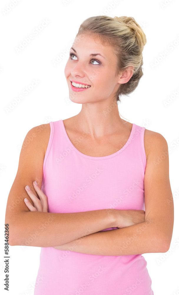 Pretty young blonde in pink looking up with arms crossed Pretty young blonde in pink looking up with arms crossed
