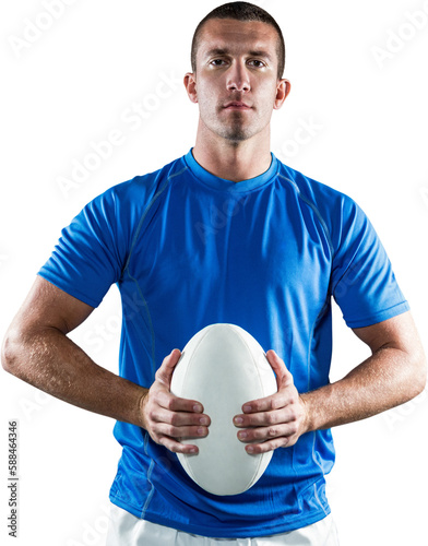 Handsome rugby player in blue jersey holding ball