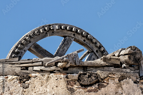 Traditional old Greek windmill, ruined in sunny sky © metapompa