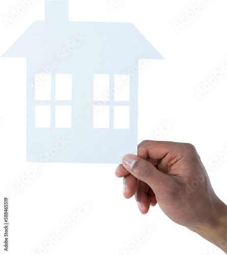 hand holding a house in paper