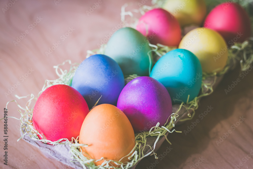 Vibrant colorful easter eggs on a wooden table Vibrant colorful easter eggs on a wooden table