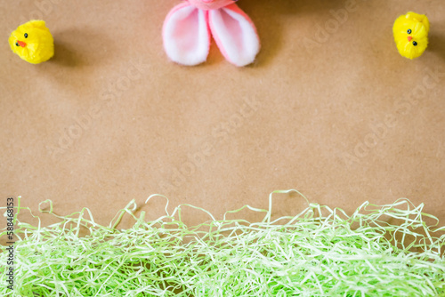 Overhead Brown Easter background with chicks and bunny ears