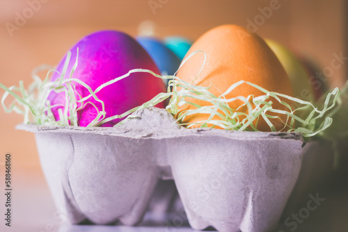 Closeup of Colorful vibrant easter eggs on a Brown Background