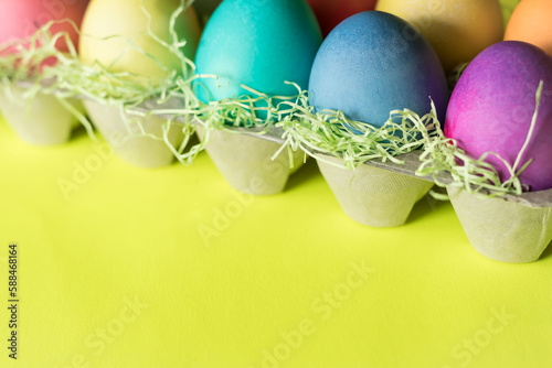 Vibrant colorful easter egg on a yellow background