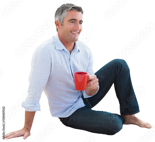 Smiling man holding coffee cup