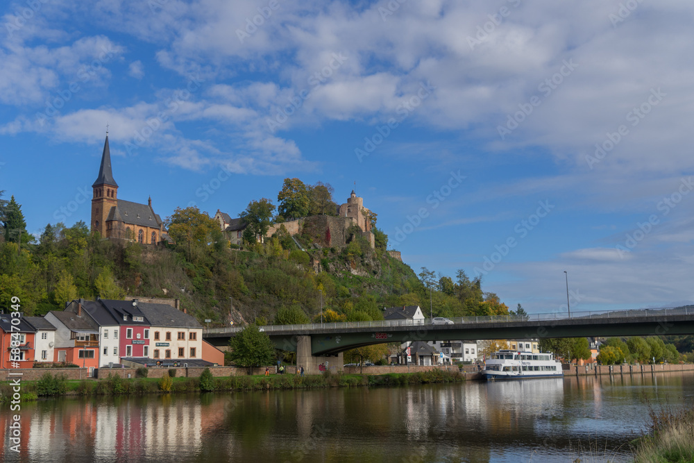 City view of the german city Saarburg with river called Saar and old castle ruin