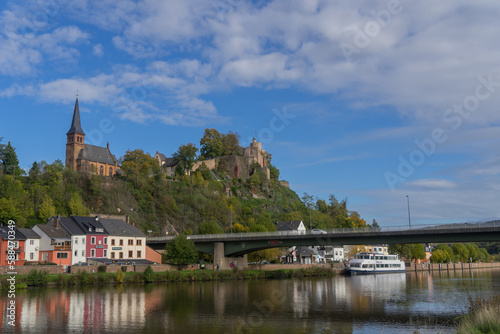 City view of the german city Saarburg with river called Saar and old castle ruin