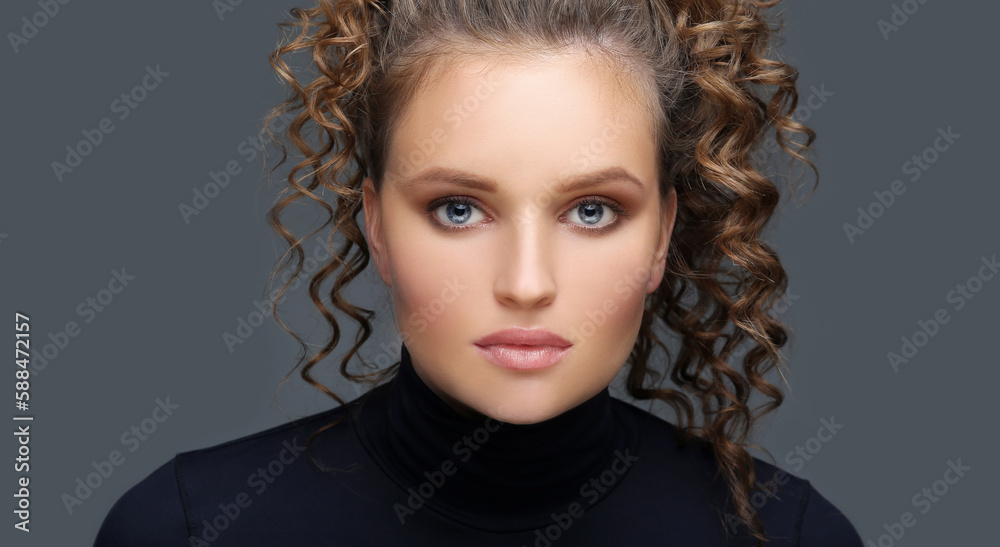 Fototapeta premium Portrait of a young blond girl with blue eyes
