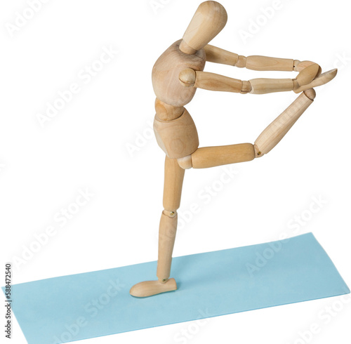 Close up of 3d wooden figurine exercising on exercise mat