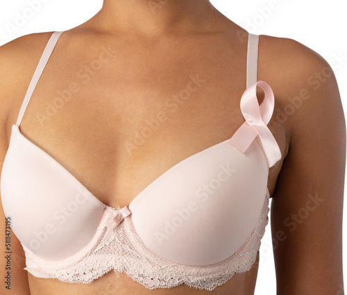 Woman in white bra with pink ribbon against white background