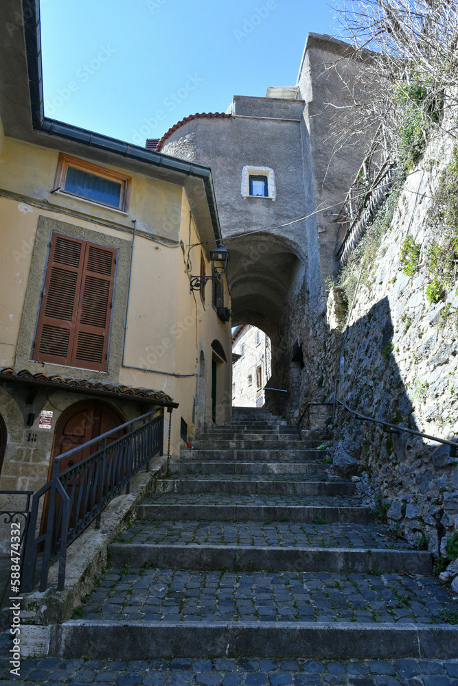 A narrow street among the old houses of Torre Cajetani, a medieval town in the province of Frosinone in Italy.