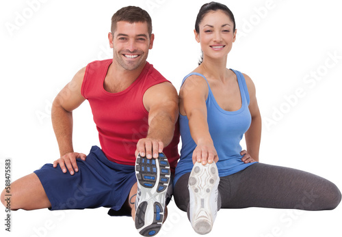 Fit man and woman stretching legs