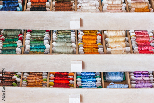 Beautiful box for threads with compartments. Beautiful colored threads in a box