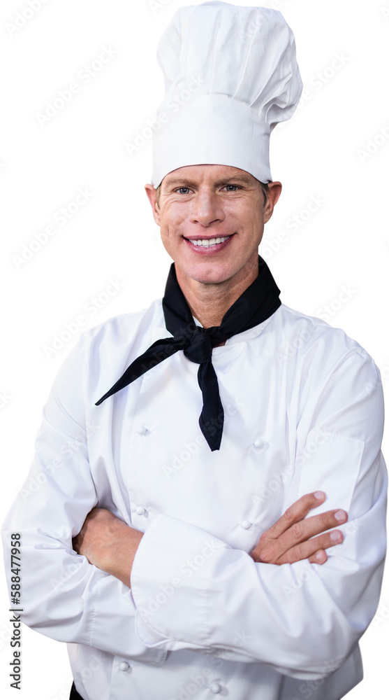 Happy male chef standing with arms crossed in kitchen Happy male chef standing with arms crossed in kitchen