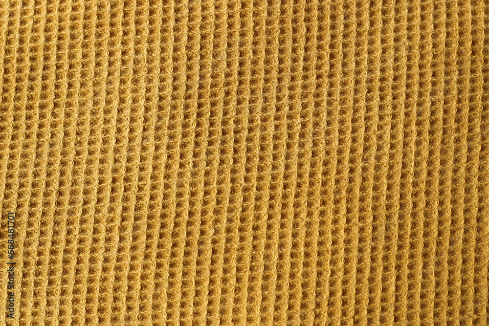 Fabric square knitted texture of mustard color.