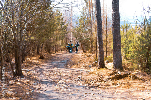 Young men with backpackes and with skis travels at mountains. Travel concept and active lifestyle.