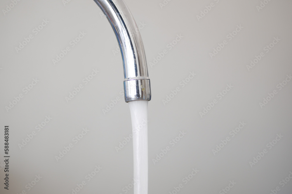 water pouring from a faucet tap slow motion water pouring from a faucet tap slow motion
