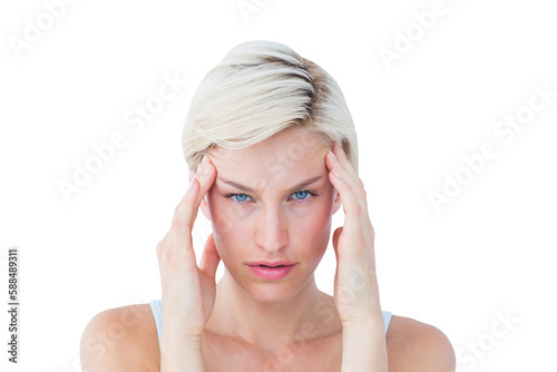 Beautiful blonde suffering from headache looking at camera 