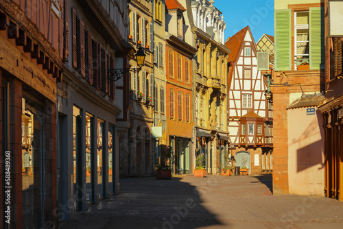 traditional half-timbered houses on street in Colmar, Alsace region, France