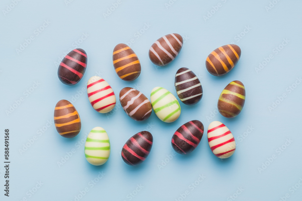 Chocolate easter eggs on blue background. Top view. Chocolate easter eggs on blue background. Top view.