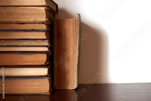 Old books on the shelf taken close-up