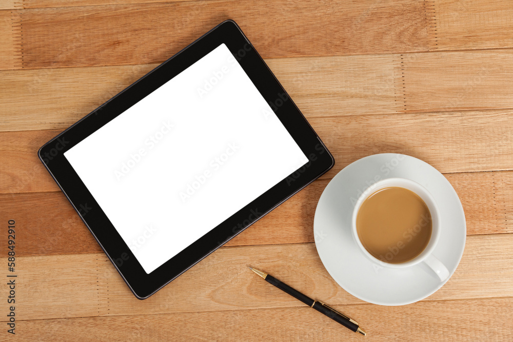 Digital tablet with pen and cup of tea Digital tablet with pen and cup of tea
