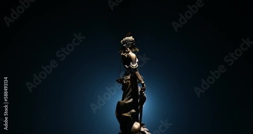 No law or dictatorship concept. The Statue of Justice with anti-riot police helmet holding scale. Creative artwork decoration with colorful toned foggy background. Selective focus